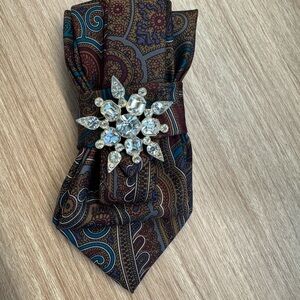 Reimagined necktie with Vintage Jewelry embellishment.